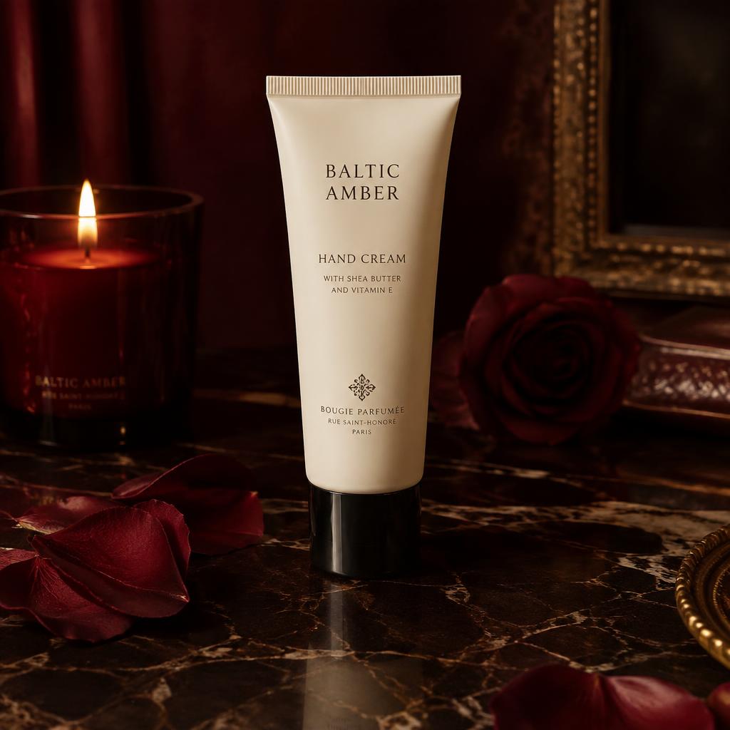 Elegant hand cream tube on dark marble with soft petals